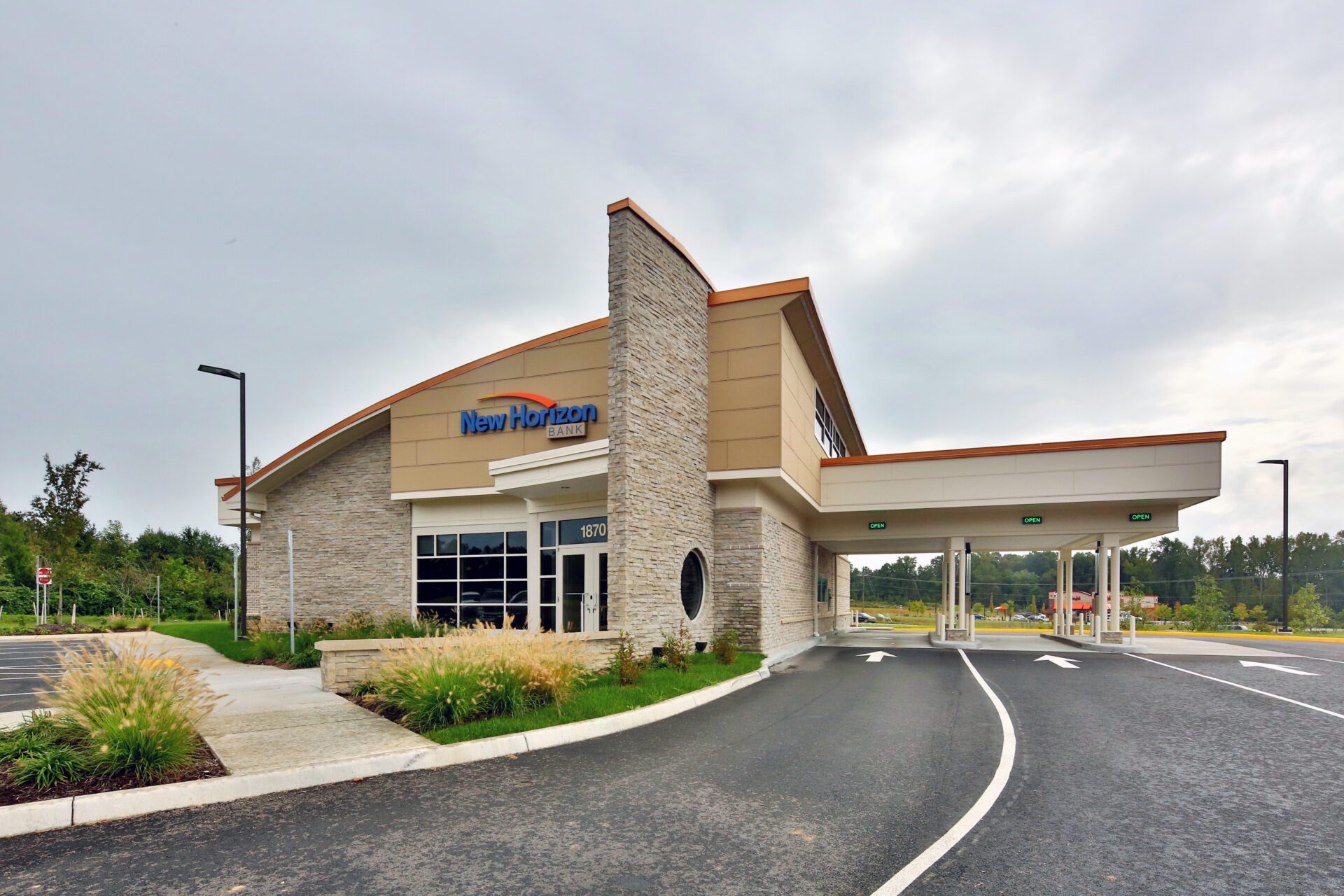 Exterior of New Horizon Bank building with clear signage