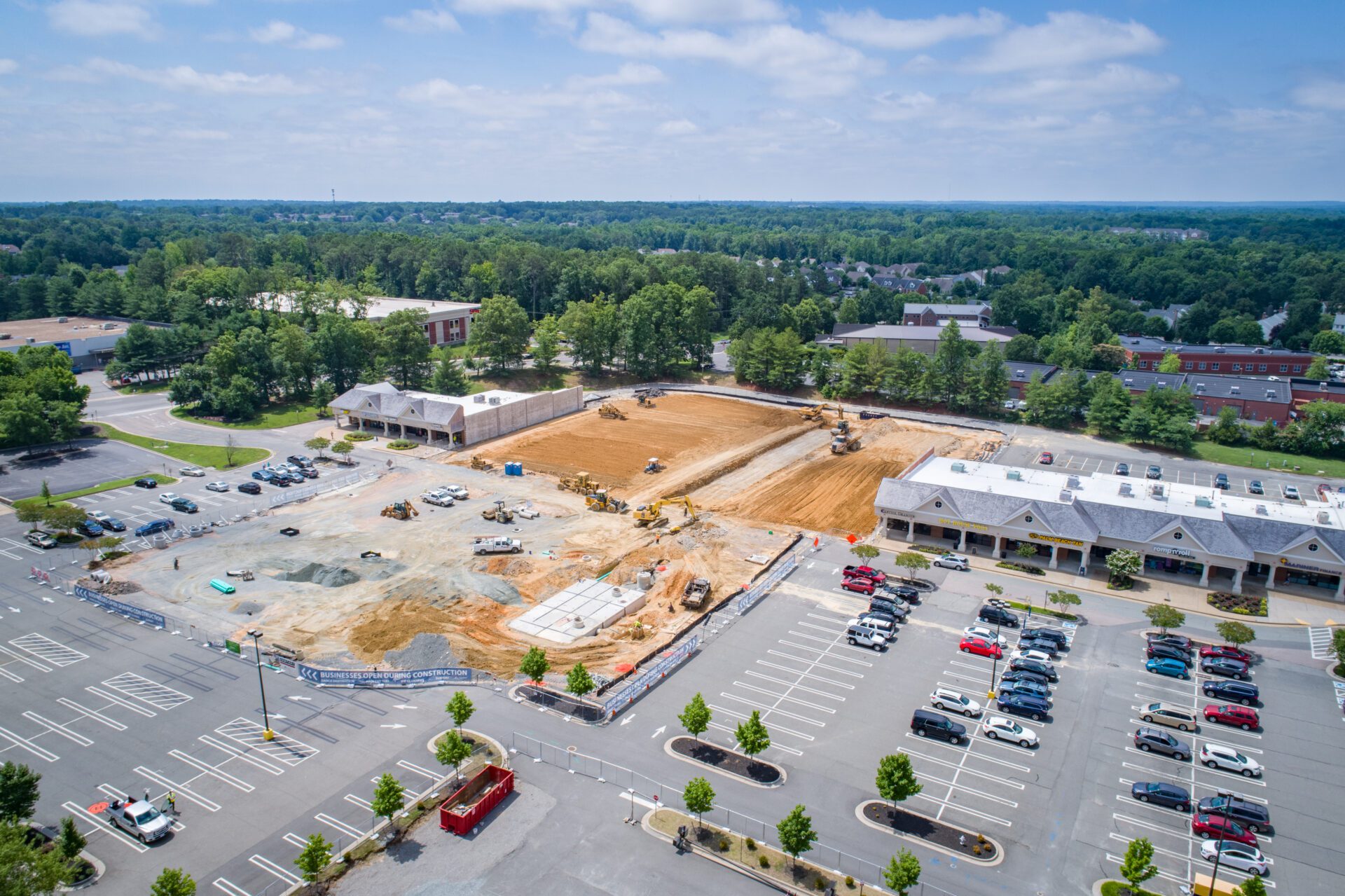 Aerial view of a construction site near a parking lot